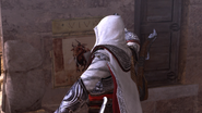 Ezio strappa un manifesto.