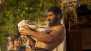 Nikolaos carrying a baby Alexios