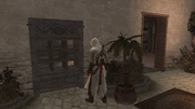 Altaïr standing near a pigeon coop in an Assassin bureau