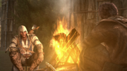 Connor with the traveler by a campfire