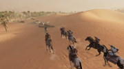 Taharqa leading Bayek and a group of men to the Reavers' hideout