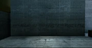 The wall displaying the braille for "The truth is constructed of lies."