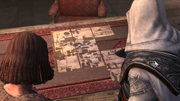 Ezio and Salaì looking at the arranged map.