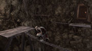 Ezio traversing a cavern