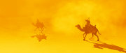 Bayek and Rahotep riding through the sandstorm
