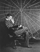 Tesla reading in front of a spiral coil