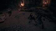 Kassandra, Harpalos, and a Follower of Ares engaged in a fight in the cave