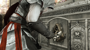 Ezio opening the sarcophagus