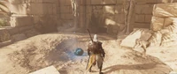 Bayek discovering a small entrance near the glowing meteor