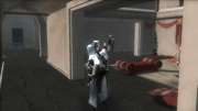 Altaïr assassinating a guard