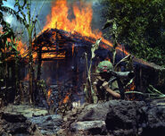 Burning Viet Cong Base camp My Tho, Vietnam, 1968