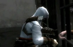 Altaïr unlocking the prison.