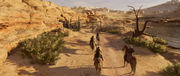 Bayek and the farmers riding towards the bandit camp, where Rahotep's father was held in