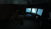 An Abstergo Entertainment employee working in the bunker