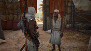 Bayek speaking to the freed villager