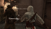 Altaïr pickpocketing a thug