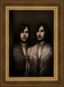 Checco (left) and Ludovico's portrait in the Villa Auditore's gallery