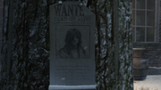 Close-up of Connor's wanted poster