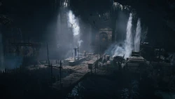 A cave featuring waterfalls and a large door.