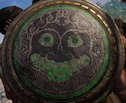 The face of a gorgon, possibly Medusa, on a shield