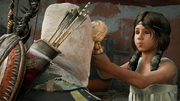 Shadya giving Bayek a "kiss" through her new doll