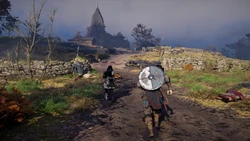 Eivor and Wulfhilda approaching the village, passing by a trail of corpses