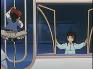 Reno hanging on a rope to get Hannah.