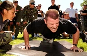 Airman executing a push-up.