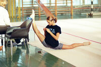 A gymnast stretching to increase flexibility.