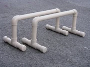 Parallettes are also commonly homemade from PVC.