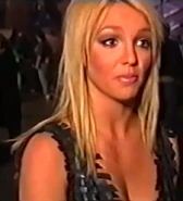 Britney wearing her fembot bra in a behind-the-scenes interview.