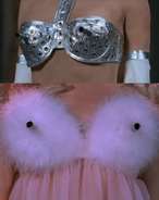 Machine gun "jubblies" of the fembots from the original film. The bottom fembot's "jubblies" shoot out a pink aphrodisiac gas.