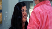 Ivana drags Austin into bed with her to commence sexual activity.