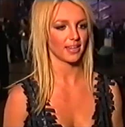 Britney wearing her fembot bra in a behind-the-scenes interview.