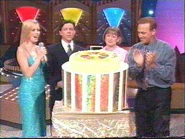 John Deeks brings out the cake.