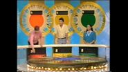 The contestants' podiums from an early 1984 episode, with the sunburst backdrops based on the American version's 1981-1989 backdrop