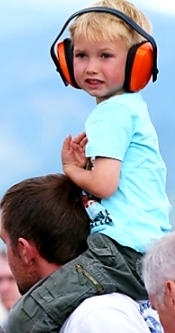 Child wearing ear defenders