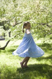 A girl spinning around, a common method of stimming