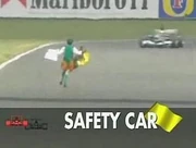 Horan runs onto the track into the path of 's . Caption on this television screenshot indicates deployment of safety car as a result.