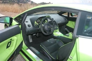 Lamborghini Gallardo interior in Black with Ithaca Green piping, door inserts and instrument cluster surround.