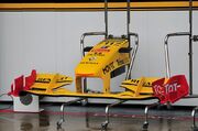 A low downforce spec. front wing on the  F1 car. Front wings heavily influence the cornering speed and handling of a car, and are regularly changed depending on the downforce requirements of a circuit.