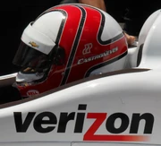 Castroneves sitting in his car on the final day of practice for the 