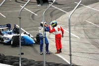 Paul Tracy and  in a confrontation at the 2006 Denver Grand Prix