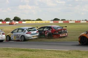 Championship contenders Jason Plato (SEAT) and Fabrizio Giovanardi (Vauxhall) collide during a BTCC race at Snetterton in July 2007. The BTCC is known for being a high-contact series