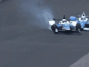 On lap 53 of the , Scott Dixon slammed into the back of a damaged , sending him flying into the inside barrier. Both drives were uninjured.