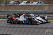 A grey, red and blue racing car