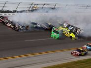 Fall 2012: Tony Stewart and twenty four other cars are involved in a last lap crash. Matt Kensith would go on to win.