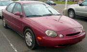 The 1996  was the first flexible-fuel vehicle produced with versions capable of running with either  or  blended with gasoline.