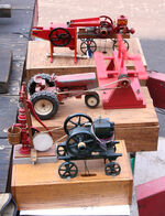 Early internal-combustion engines were used to power farm equipment similar to these models.