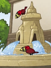 Roodvlam Papegaaiduikers op de schalen van de fontein